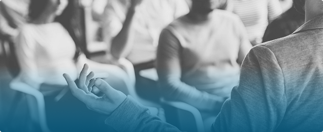 Audience attending an ESG summit presentation